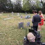 Harry Treadaway and Kelly Lynch as the Hartsfields, at the grave of her deceased husband, his volatile father.