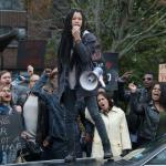 Lex Scott Davis as Nya, urging her community to resist The Purge